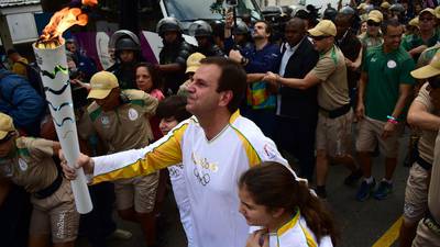 Rio police use tear gas  to  clear protesters in  path of  Olympic torch