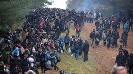 Polish forces turn water cannon on migrants at Belarusian border