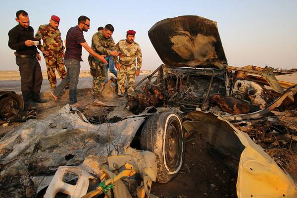 Isis claims Iraq suicide attacks in which at least 50 killed