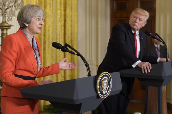 Theresa May says UK does not agree with Trump refugee ban