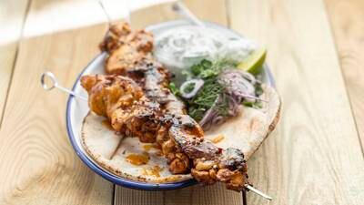 Barbecued chicken shawarma with flatbread and tzatziki