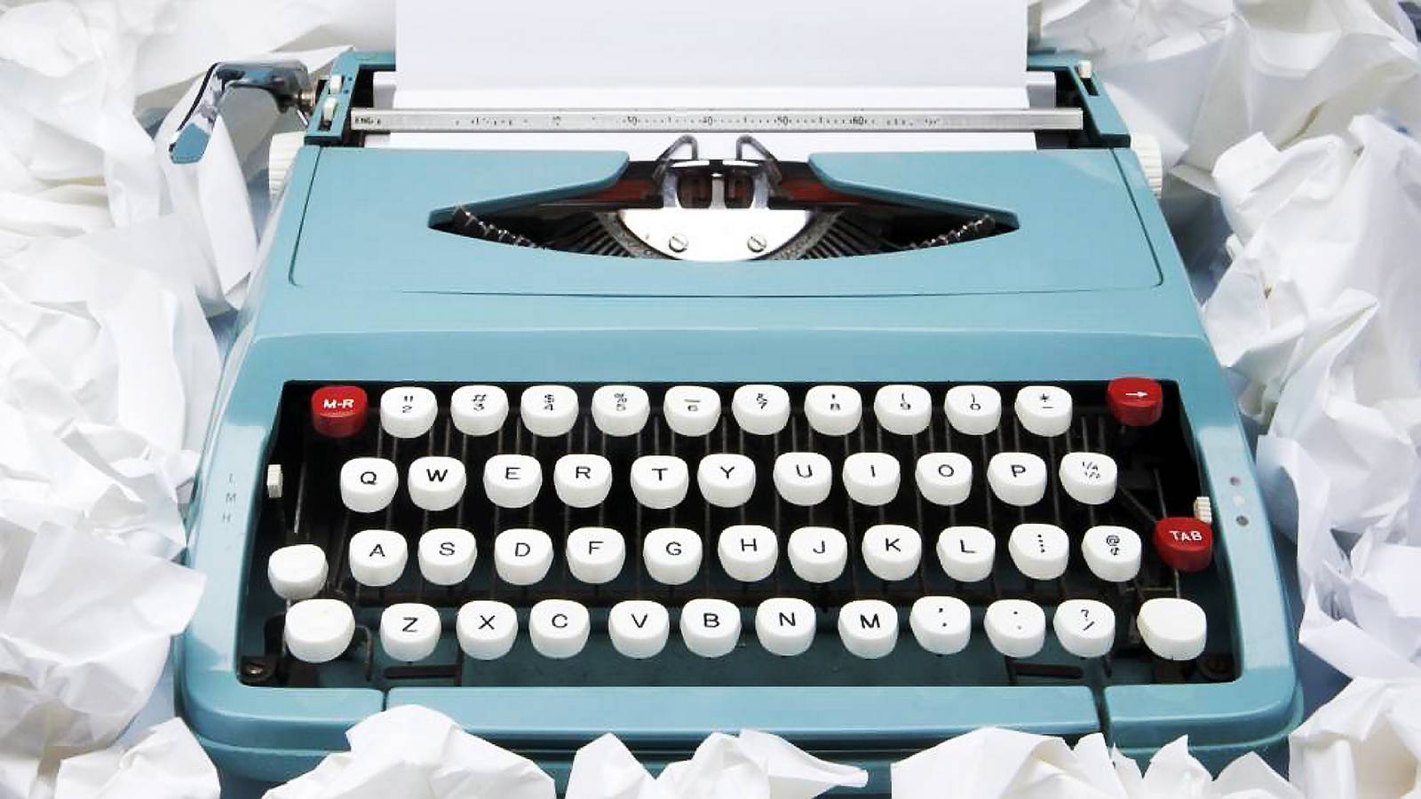 Still life of typewriter with crumpled paper around it Pic: getty images writing writer