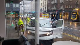 Van crashes into Irish Times building after collision with unmarked Garda car