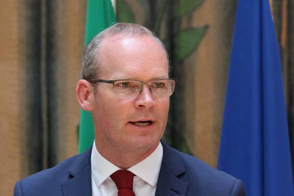 Simon Coveney rejects ‘barriers, checks and fences’ on trip to Berlin