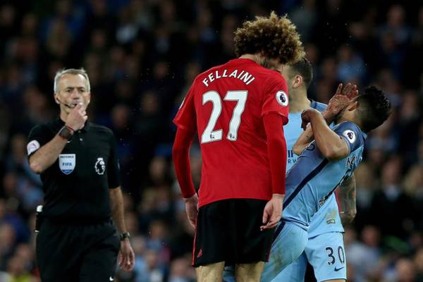 Fellaini sees red for head-butt in dull Manchester derby