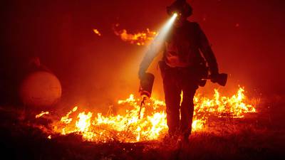 California wildfires: Three dead, 64,000 on verge of evacuation