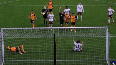 Wolves steady the ship with comeback win over nine-man Arsenal