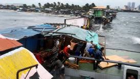 Typhoon kills 10 in Philippines and prompts mass evacuations
