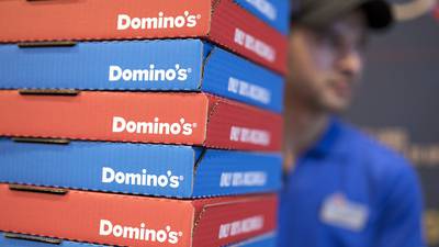 Domino’s Pizza warns over writedowns as it posts sales hike