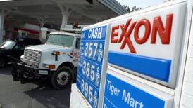 Weak oil prices hit Exxon profits