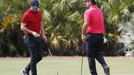 Tiger Woods touched by red and black tribute by fellow players