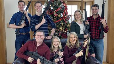 US congressman condemned for posting Christmas photo with several guns