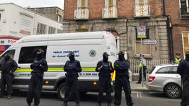 Photographs of gardaí in hoods ‘do not inspire confidence’