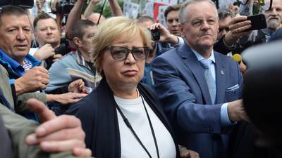 Polish PM under attack as supreme court judge refuses to retire