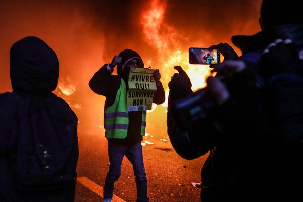Clashes break out at Paris protest against Macron’s security law