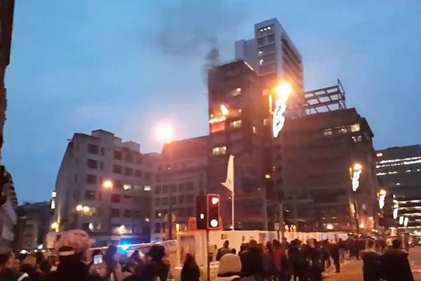 Firefighters battle blaze in 12 storey building in Manchester