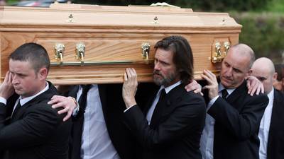 Jim Carrey helps carry coffin at funeral  of Cathriona White