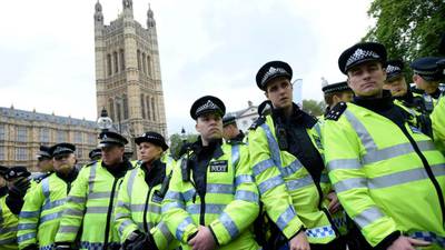 London police contain rival protests over killing