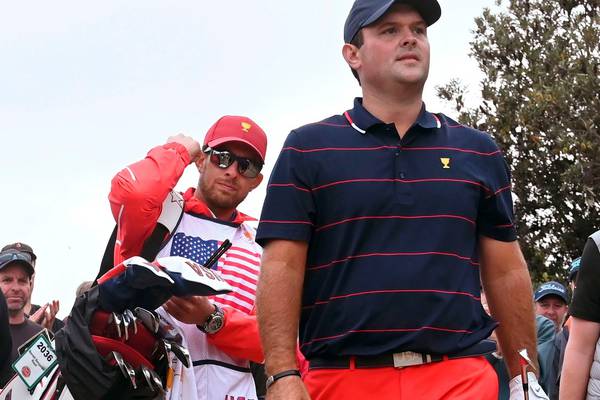 Patrick Reed’s caddie banned after altercation with fan at Presidents Cup