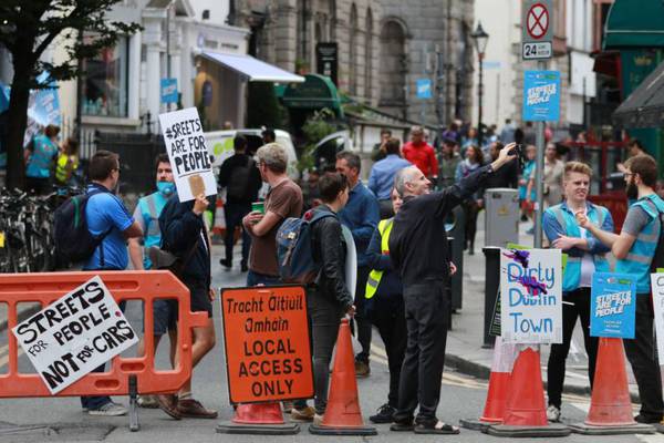 Environmental activists block traffic in Dublin city centre