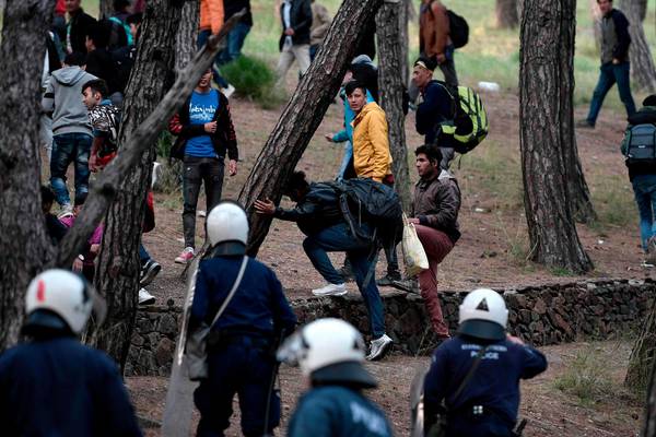 Greek and Turkish police fire tear gas as migrant border crisis deepens