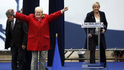 Marine Le Pen loses control of May Day  to topless activists and elderly father
