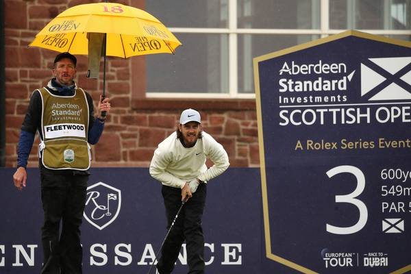 Tommy Fleetwood thrives in horrendous conditions at Scottish Open