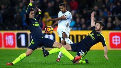 Arsenal hit Swansea for four to go third