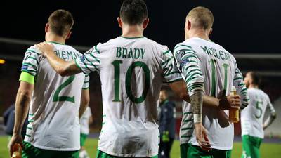 New number 10 Robbie Brady and John O’Shea content with the point