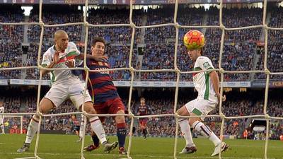 Lionel Messi treble lifts Barcelona to the top of La Liga