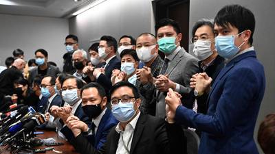 Hong Kong pro-democracy lawmakers resign en masse after Beijing crackdown