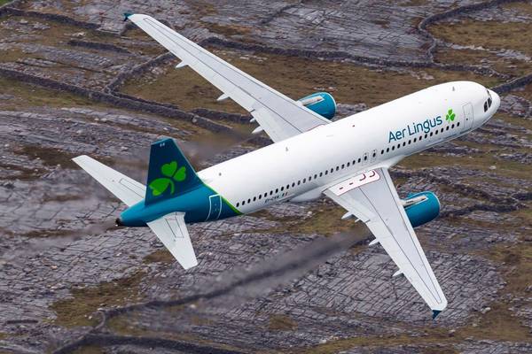 Profit at Aer Lingus owner down more than a third in first half