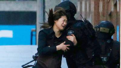 Three dead after hostages held in Sydney cafe siege