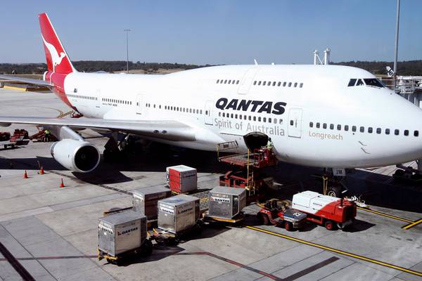 Qantas halts most international flights until October on border closure