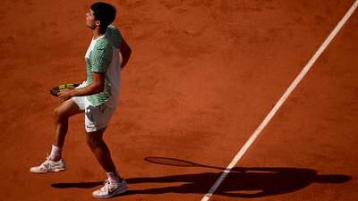 Novak Djokovic through to French Open final after Carlos Alcaraz hobbled by cramp 