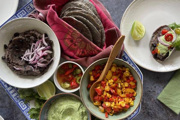 Home-made corn tortillas with black beans and peppers