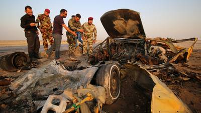 Isis claims Iraq suicide attacks in which at least 50 killed