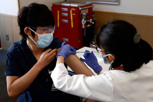 Auckland’s lockdown to end as Japan begins vaccination drive
