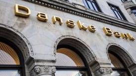 Danske Bank third quarter lags forecast, negative rates hurts