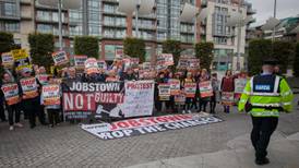Protesters outside court where Joan Burton is giving evidence