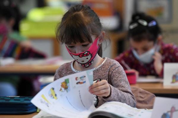 German schoolchildren return amid debate on new virus benchmarks