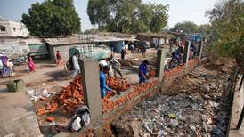 Indian city builds wall hiding slum ahead of Trump visit