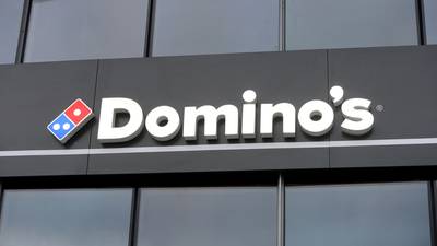 Domino’s sees profit at lower end of range, shares down
