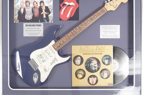 Guitar signed by the Rolling Stones expected to sell for about €3,000