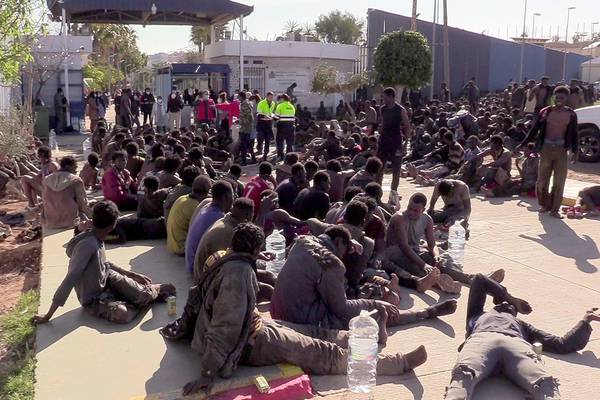 Hundreds of migrants scale border fence to reach Spanish territory