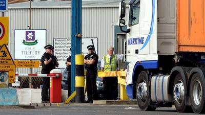 Man dies after 30 found in container in England