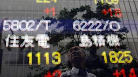 Asian shares stay near highs, dollar hobbled by Fed