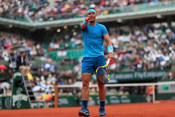 Rafael Nadal faces a battle as play suspended at French Open