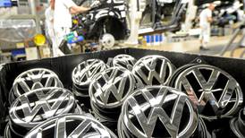 Volkswagen profit falls due to scandal and  lower sales