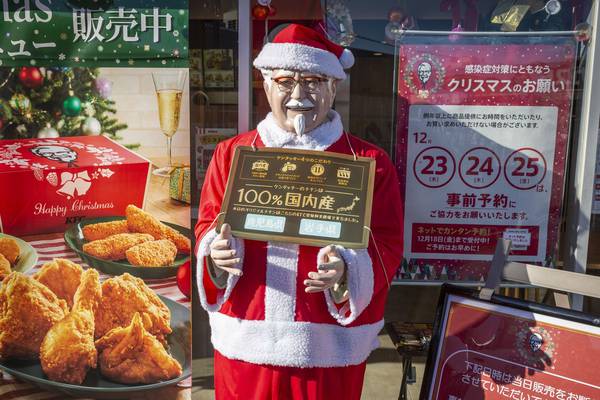 How do we celebrate Christmas where I live? With buckets of KFC and Colonel Sanders Santas